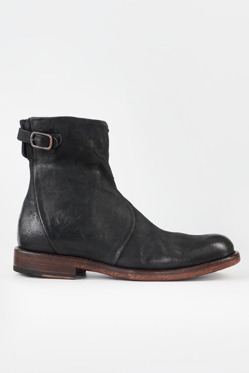 EYTON matte-black laceless ankle boots.